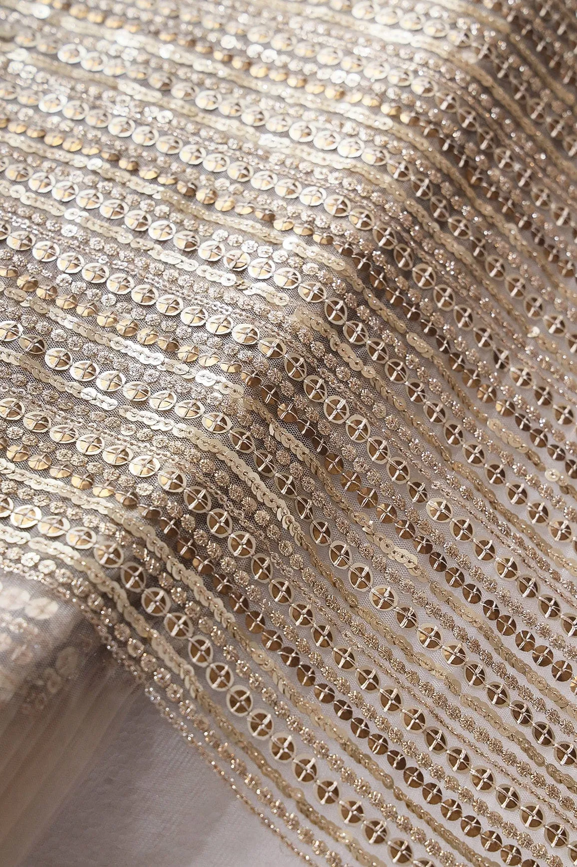 Beautiful Heavy Sequins With Zari Stripes Embroidery On Beige Soft Net Fabric