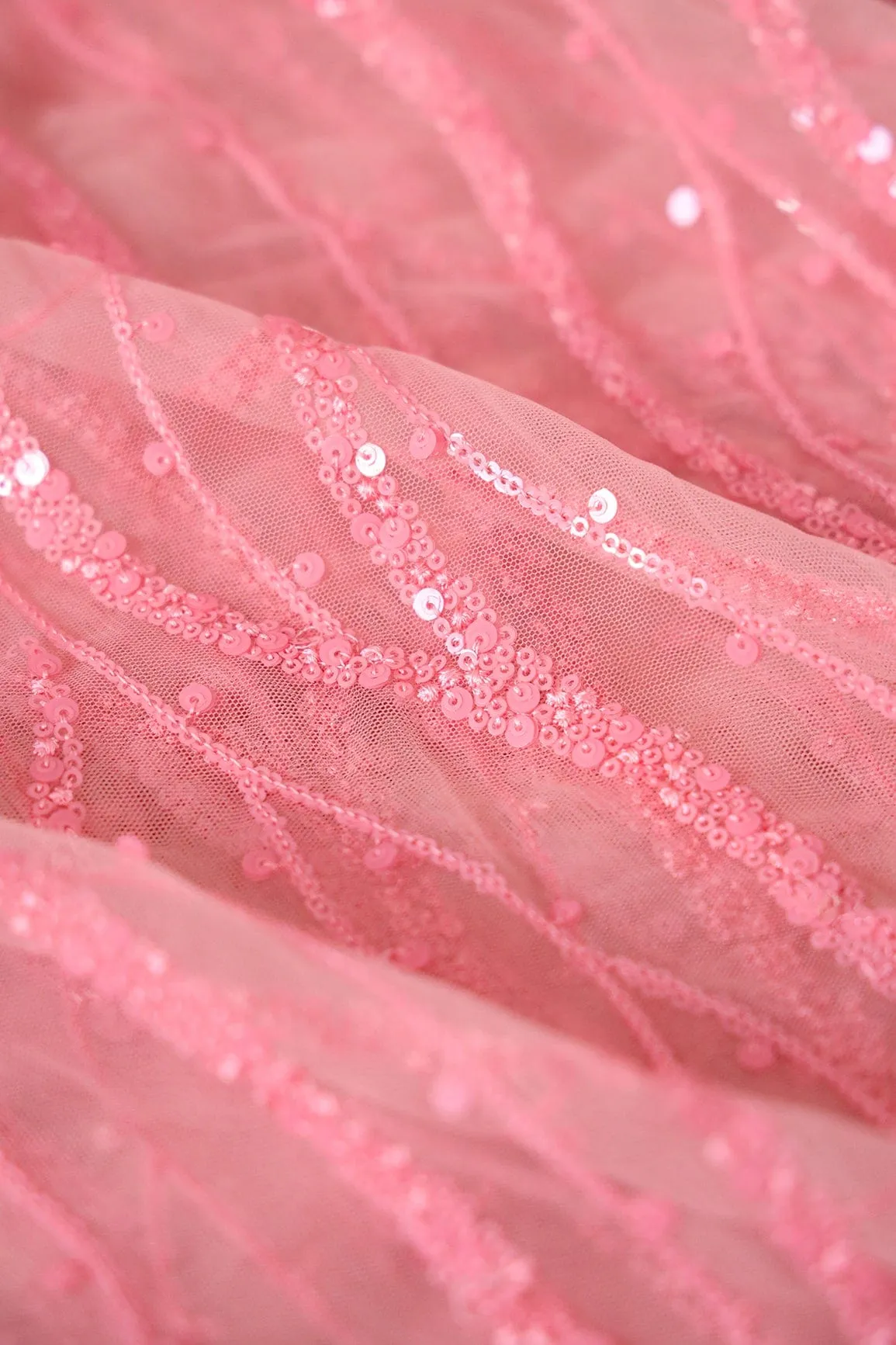 Beautiful Sequins With Pink Thread Wavy Embroidery Work On Pink Soft Net Fabric