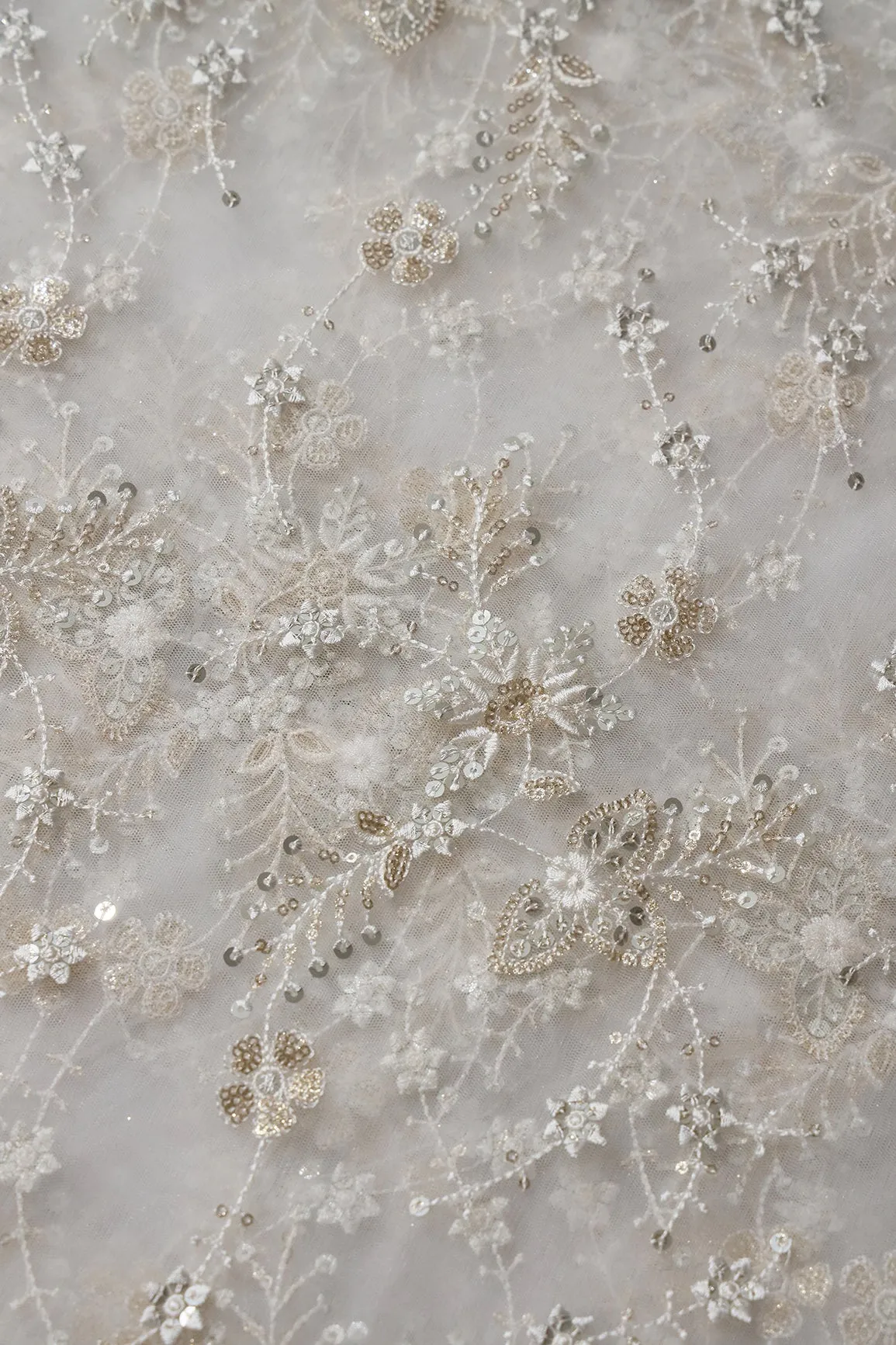 Beautiful White Thread With Sequins Floral Embroidery Work On White Dyeable Soft Net Fabric