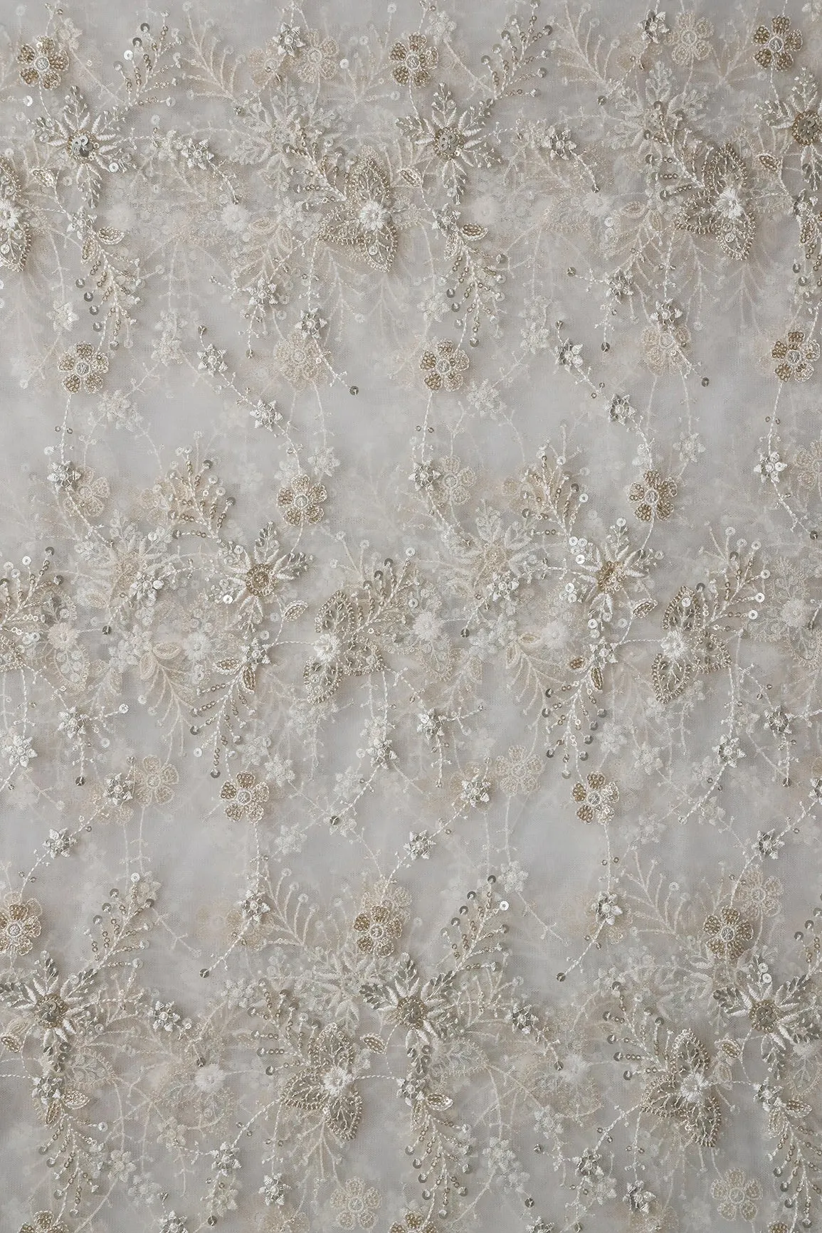 Beautiful White Thread With Sequins Floral Embroidery Work On White Dyeable Soft Net Fabric
