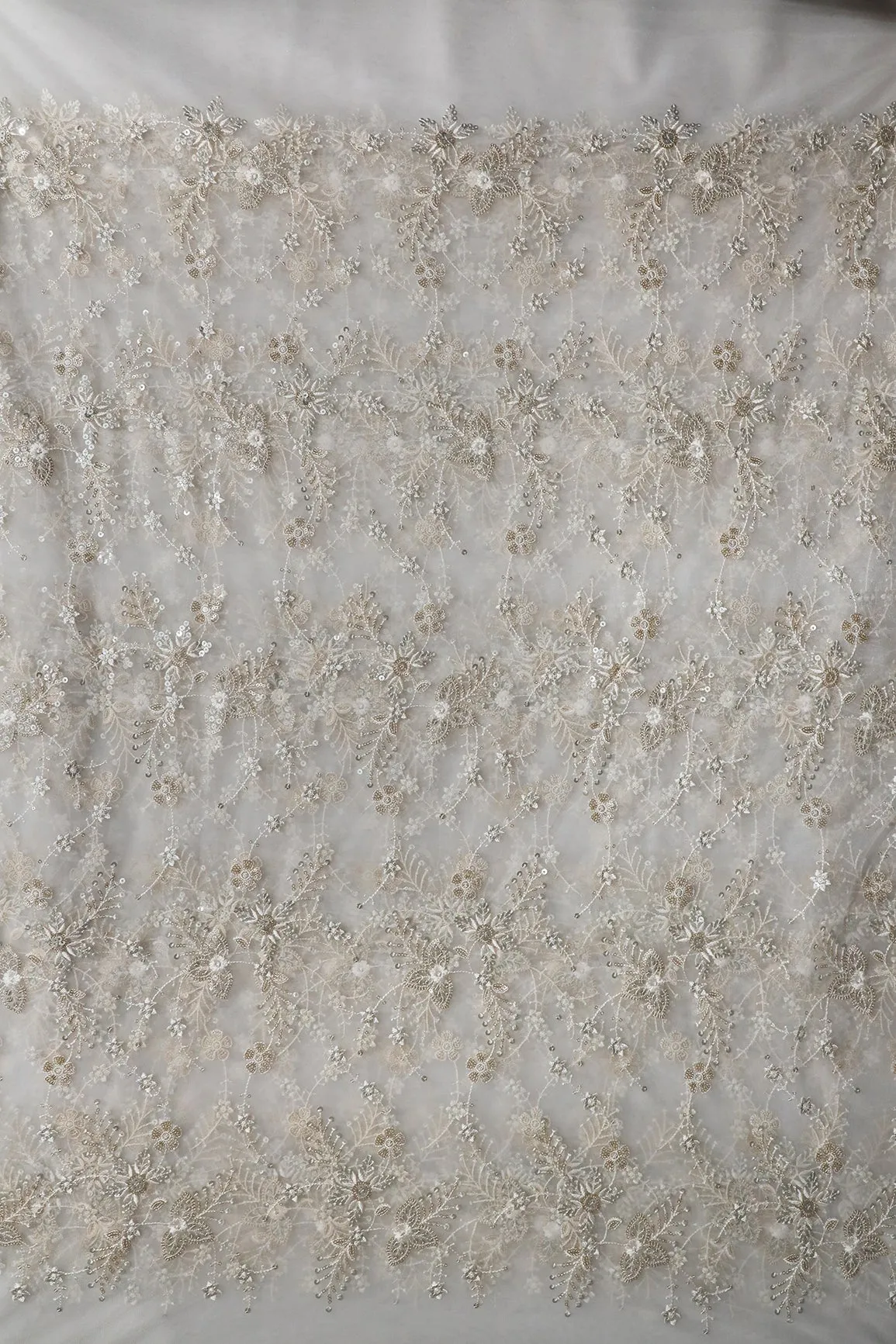 Beautiful White Thread With Sequins Floral Embroidery Work On White Dyeable Soft Net Fabric
