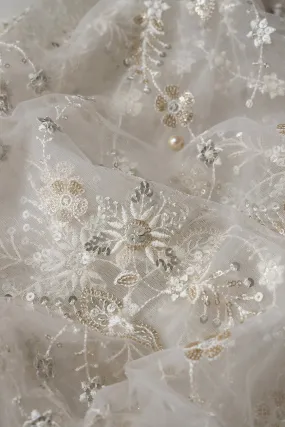 Beautiful White Thread With Sequins Floral Embroidery Work On White Dyeable Soft Net Fabric